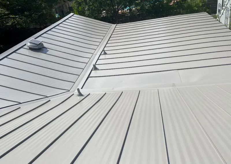 Solar attic fan installed on a metal roof for Roof Ventilation in Irvine